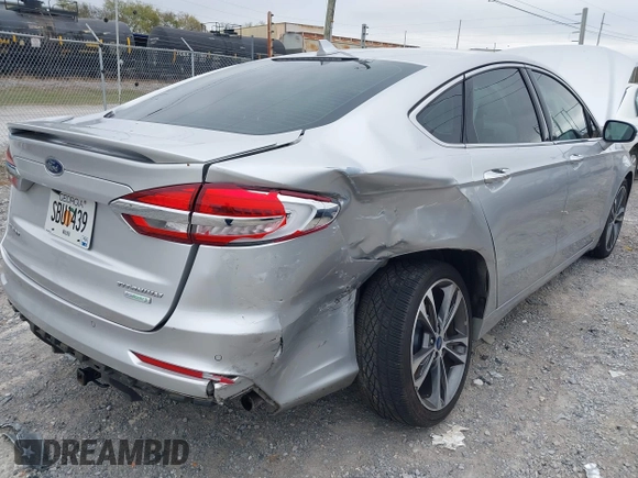 2019 Ford Fusion Titanium with VIN 3FA6P0K96KR120749, listed as a IAAI auction lot 40737085 with 118,376 mi miles and . Bid and sale history available at DreamBid. Image 6.