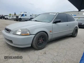 1996 Honda Civic DX z VIN 2HGEJ6340TH104039, wystawiony jako Copart lot #59538685 z przebiegiem 151 668 mil mil oraz Czysty tytuł • Clean title. Historia ofert i sprzedaży dostępna na DreamBid. Obrazek 1.