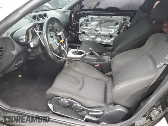 2007 Nissan 350Z Enthusiast z VIN JN1BZ34D87M502614, wystawiony jako Copart lot #53355955 z przebiegiem 70 416 mil mil oraz Szkoda całkowita • Salvage title. Historia ofert i sprzedaży dostępna na DreamBid. Obrazek 7.