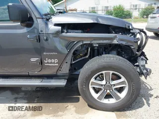 2022 Jeep Wrangler Unlimited Sahara Altitude z VIN 1C4HJXEG6NW103779, wystawiony jako IAAI lot #42563826 z przebiegiem 79 315 mil mil oraz . Historia ofert i sprzedaży dostępna na DreamBid. Obrazek 17.