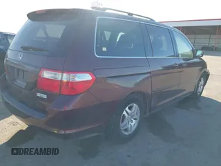 2007 Honda Odyssey EX-L with VIN 5FNRL38697B460066, listed as a IAAI auction lot 41453305 with 169,008 mi miles. Bid and sale history available at carsss.com. Image 4.