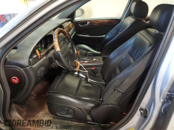 2004 Jaguar XJ with VIN SAJEA71C84SG07220, listed as a Copart auction lot 70916164 with 151,102 mi miles and Salvage Title. Bid and sale history available at carsss.com. Image 7.