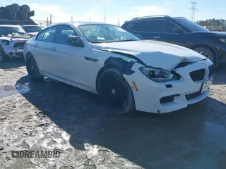2013 BMW 6 Series 650i xDrive with VIN WBA6B4C59DD098329, listed as a IAAI auction lot 41404788 with 139,677 mi miles. Bid and sale history available at carsss.com. Image 1.