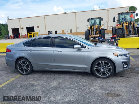 2020 Ford Fusion Titanium with VIN 3FA6P0D95LR199443, listed as a IAAI auction lot 42721371 with 77,592 mi miles and . Bid and sale history available at DreamBid. Image 13.