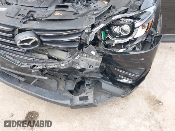 2016 Mazda CX-5 Grand Touring with VIN JM3KE2DY0G0651300, listed as a IAAI auction lot 41678833 with 98,790 mi miles. Bid and sale history available at carsss.com. Image 6.