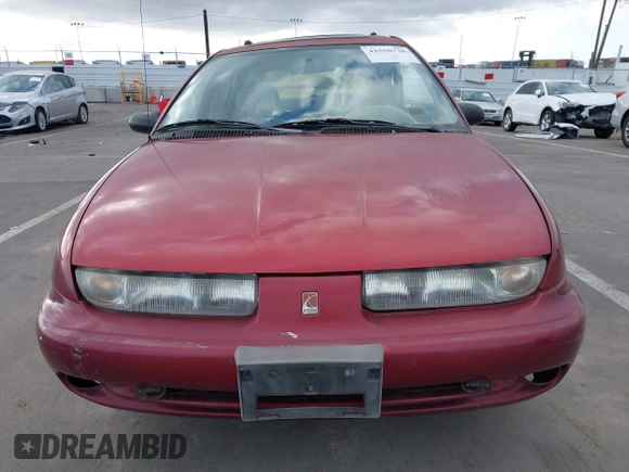 1999 Saturn SW z VIN 1G8ZK8276XZ333989, wystawiony jako IAAI lot #41550338 z przebiegiem 142 592 mil mil oraz . Historia ofert i sprzedaży dostępna na DreamBid. Obrazek 12.
