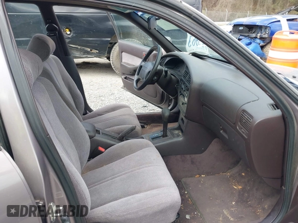 1994 Toyota Camry LE z VIN 4T1SK12E0RU463582, wystawiony jako IAAI lot #41823733 z przebiegiem 120 050 mil mil oraz . Historia ofert i sprzedaży dostępna na DreamBid. Obrazek 5.