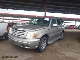 2002 Cadillac Escalade with VIN 1GYEK63N22R209467, listed as a IAAI auction lot 41816247 with 213,770 mi miles. Bid and sale history available at carsss.com. Image 2.