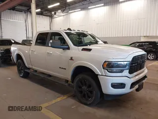 2021 Ram 2500 Laramie with VIN 3C6UR5FL4MG591402, listed as a IAAI auction lot 41372864 with 21,540 mi miles and . Bid and sale history available at DreamBid. Image 1.