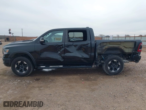2020 Ram 1500 Rebel with VIN 1C6SRFLT5LN113514, listed as a IAAI auction lot 41718662 with 56,730 mi miles and . Bid and sale history available at DreamBid. Image 14.