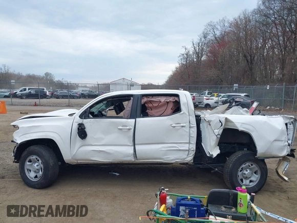 2022 Toyota Tacoma SR with VIN 3TYAX5GN3NT062077, listed as a IAAI auction lot 41886531 with 58,687 mi miles and . Bid and sale history available at DreamBid. Image 14.