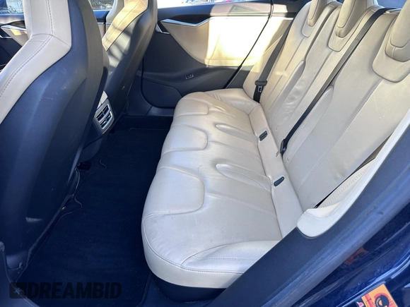 2013 Tesla Model S with VIN 5YJSA1DN8DFP17027, listed as a IAAI auction lot 42168317 with 148,394 mi miles. Bid and sale history available at carsss.com. Image 8.