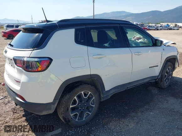 2021 Jeep Compass Trailhawk with VIN 3C4NJDDB0MT551172, listed as a IAAI auction lot 40155947 with 50,794 mi miles and . Bid and sale history available at DreamBid. Image 4.