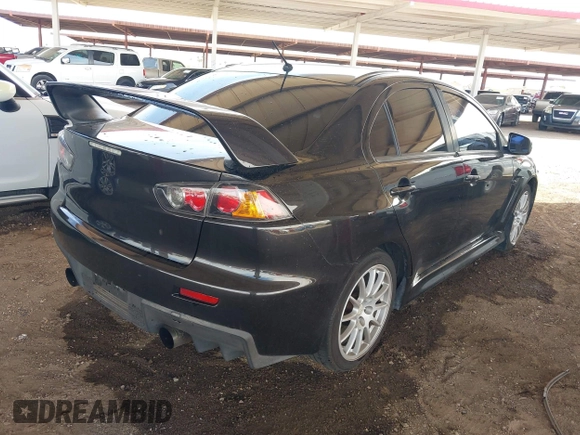2013 Mitsubishi Lancer Evolution GSR with VIN JA32W8FV6DU009257, listed as a IAAI auction lot 41917942 with 125,279 mi miles. Bid and sale history available at carsss.com. Image 4.