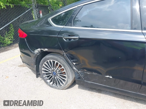 2017 Ford Fusion Titanium with VIN 3FA6P0D92HR252476, listed as a IAAI auction lot 40176942 with 88,818 mi miles and . Bid and sale history available at DreamBid. Image 6.
