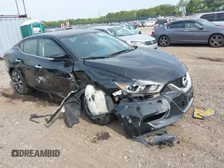 2016 Nissan Maxima Platinum z VIN 1N4AA6AP8GC901079, wystawiony jako IAAI lot #42423396 z przebiegiem 100 750 mil mil oraz . Historia ofert i sprzedaży dostępna na DreamBid. Obrazek 1.