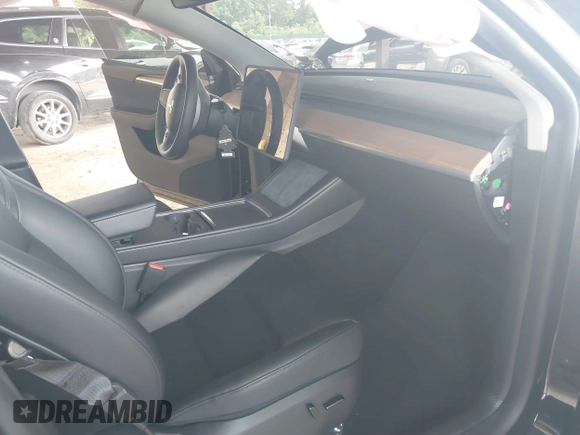 2023 Tesla Model Y Long Range with VIN 7SAYGDEE3PA185778, listed as a IAAI auction lot 39721611 with 11,986 mi miles and . Bid and sale history available at DreamBid. Image 5.