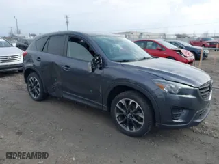 2016 Mazda CX-5 Grand Touring with VIN JM3KE4DY5G0825695, listed as a IAAI auction lot 41813084 with 105,886 mi miles. Bid and sale history available at carsss.com. Image 1.