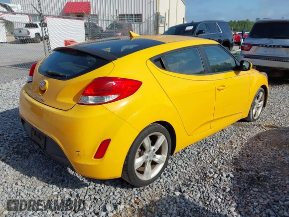 2012 Hyundai Veloster w/Gray Int z VIN KMHTC6AD2CU079902, wystawiony jako IAAI lot #42088473 z przebiegiem 143 983 mil mil oraz . Historia ofert i sprzedaży dostępna na DreamBid. Obrazek 4.