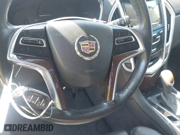 2014 Cadillac SRX Performance Collection z VIN 3GYFNCE35ES517868, wystawiony jako IAAI lot #41775522 z przebiegiem 166 960 mil mil oraz . Historia ofert i sprzedaży dostępna na DreamBid. Obrazek 11.