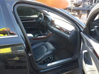 2014 Audi S8 with VIN WAUD2AFD8EN003571, listed as a IAAI auction lot 41590474 with 102,342 mi miles. Bid and sale history available at carsss.com. Image 5.