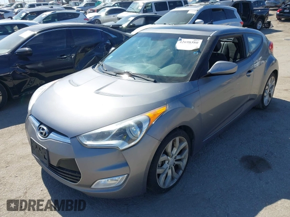 2013 Hyundai Veloster w/Black Int with VIN KMHTC6AD5DU095867, listed as a IAAI auction lot 42698380 with 115,528 mi miles and . Bid and sale history available at DreamBid. Image 2.