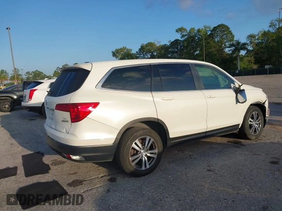 2017 Honda Pilot EX-L with VIN 5FNYF6H51HB037690, listed as a IAAI auction lot 41976359 with 126,055 mi miles and . Bid and sale history available at DreamBid. Image 4.