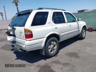1999 Isuzu Rodeo S with VIN 4S2CK58W7X4325703, listed as a IAAI auction lot 42715480 with 205,420 mi miles and . Bid and sale history available at DreamBid. Image 4.