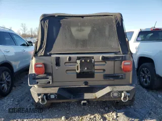 2004 Jeep Wrangler Rubicon with VIN 1J4FA69S94P778836, listed as a Copart auction lot 82884304 with 168,045 mi miles and Salvage Title. Bid and sale history available at carsss.com. Image 6.