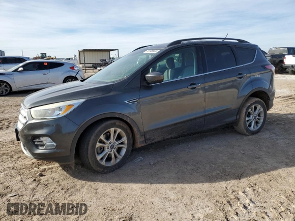 2018 Ford Escape SE with VIN 1FMCU9GD6JUB12810, listed as a Copart auction lot 82598864 with 138,640 mi miles and Salvage Title. Bid and sale history available at carsss.com. Image 1.