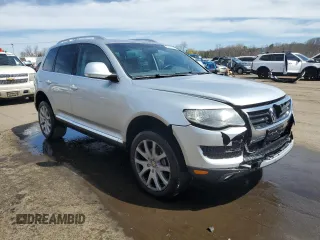 2010 Volkswagen Touareg VR6 with VIN WVGBF7A97AD004355, listed as a Copart auction lot 52861335 with 129,454 mi miles and Salvage Title. Bid and sale history available at DreamBid. Image 4.