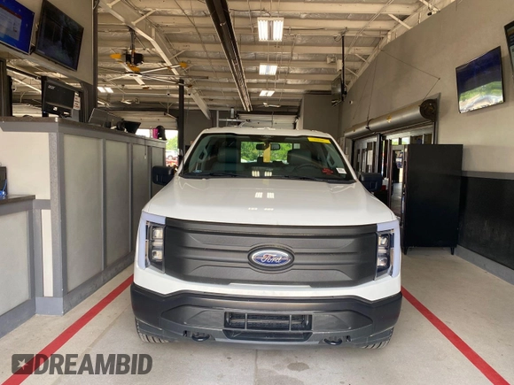 2022 Ford F-150 Lightning Pro with VIN 1FTVW1EL5NWG11725, listed as a IAAI auction lot 42832825 with 5,044 mi miles and . Bid and sale history available at DreamBid. Image 17.