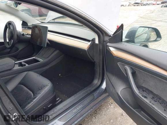 2022 Tesla Model 3 Long Range with VIN 5YJ3E1EB8NF201023, listed as a IAAI auction lot 41942943 with 30,635 mi miles and . Bid and sale history available at DreamBid. Image 5.