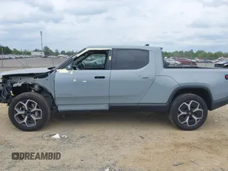 2023 Rivian R1T Adventure z VIN 7FCTGBAA6PN028520, wystawiony jako IAAI lot #42117498 z przebiegiem 24 583 mil mil oraz . Historia ofert i sprzedaży dostępna na DreamBid. Obrazek 15.