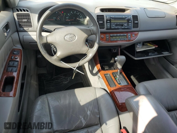 2002 Toyota Camry XLE z VIN 4T1BF32K22U532171, wystawiony jako Copart lot #54527965 z przebiegiem 165 637 mil mil oraz Szkoda całkowita • Salvage title. Historia ofert i sprzedaży dostępna na DreamBid. Obrazek 8.