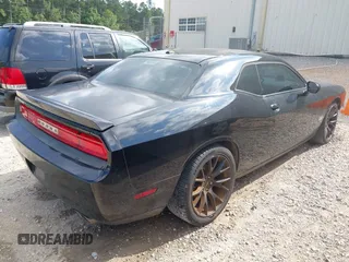 2014 Dodge Challenger R/T Plus z VIN 2C3CDYBT1EH201887, wystawiony jako IAAI lot #42225211 z przebiegiem 278 574 mil mil oraz . Historia ofert i sprzedaży dostępna na DreamBid. Obrazek 4.