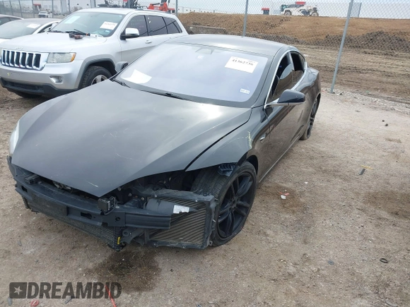 2017 Tesla Model S 100D z VIN 5YJSA1E27HF208282, wystawiony jako IAAI lot #41362736 z przebiegiem 173 162 mil mil oraz . Historia ofert i sprzedaży dostępna na DreamBid. Obrazek 2.