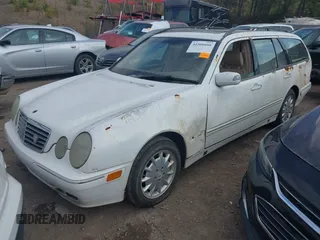 2001 Mercedes-Benz E-Class AWD with VIN WDBJH82J61X057506, listed as a IAAI auction lot 41506666 with 304,332 mi miles. Bid and sale history available at carsss.com. Image 2.