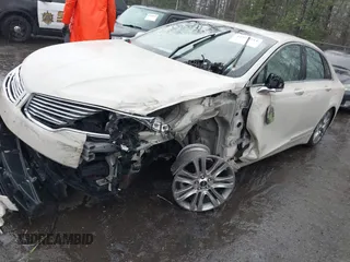 2015 Lincoln MKZ z VIN 3LN6L2JK1FR603766, wystawiony jako IAAI lot #41975944 z przebiegiem 81 547 mil mil oraz . Historia ofert i sprzedaży dostępna na DreamBid. Obrazek 2.