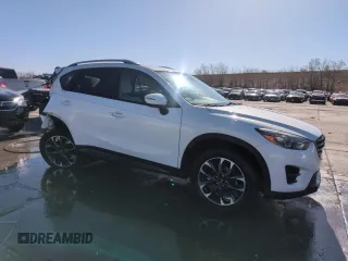2016 Mazda CX-5 Grand Touring with VIN JM3KE4DY8G0671256, listed as a Copart auction lot 52920975 with 87,822 mi miles and Non Repairable. Bid and sale history available at carsss.com. Image 4.