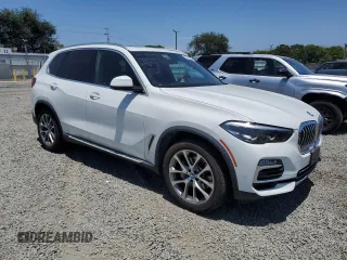 2019 BMW X5 xDrive40i with VIN 5UXCR6C54KLK88490, listed as a Copart auction lot 57917005 with 50,948 mi miles and Salvage title. Bid and sale history available at DreamBid. Image 4.