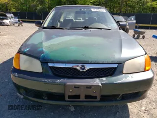 1999 Mazda Protege DX with VIN JM1BJ2223X0139775, listed as a Copart auction lot 54338455 with 63,198 mi miles and Salvage Title. Bid and sale history available at DreamBid. Image 5.