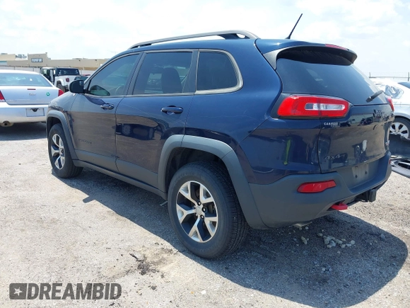 2015 Jeep Cherokee Trailhawk with VIN 1C4PJMBS3FW704622, listed as a IAAI auction lot 42465702 with 96,831 mi miles and . Bid and sale history available at DreamBid. Image 3.