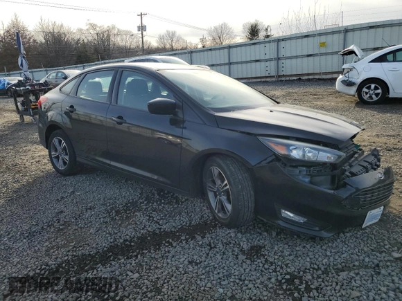 2018 Ford Focus SE z VIN 1FADP3FE6JL232769, wystawiony jako Copart lot #87667595 z przebiegiem 124 496 mil mil oraz Szkoda całkowita • Salvage title. Historia ofert i sprzedaży dostępna na DreamBid. Obrazek 4.