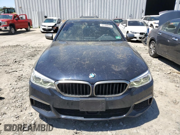 2018 BMW 5 Series M550i xDrive with VIN WBAJB9C56JB286479, listed as a Copart auction lot 57108645 with 71,782 mi miles and Salvage title. Bid and sale history available at DreamBid. Image 5.