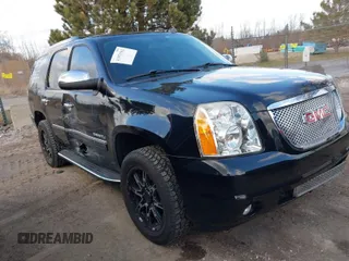 2012 GMC Yukon Denali with VIN 1GKS2EEF8CR320121, listed as a IAAI auction lot 41976562 with 157,050 mi miles. Bid and sale history available at carsss.com. Image 1.