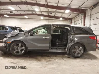 2021 Honda Odyssey Touring with VIN 5FNRL6H82MB025923, listed as a IAAI auction lot 42104290 with 61,178 mi miles and . Bid and sale history available at DreamBid. Image 15.