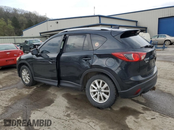2014 Mazda CX-5 Touring with VIN JM3KE2CY8E0424757, listed as a Copart auction lot 54703195 with 111,401 mi miles and Salvage Title. Bid and sale history available at DreamBid. Image 2.