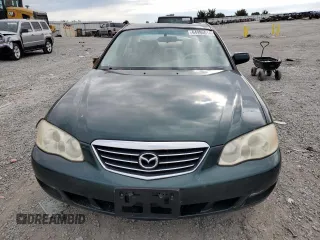 2001 Mazda Millenia z VIN JM1TA221011708952, wystawiony jako Copart lot #64995014 z przebiegiem Nie podano mil oraz Szkody całkowita. Historia ofert i sprzedaży dostępna na DreamBid. Obrazek 5.
