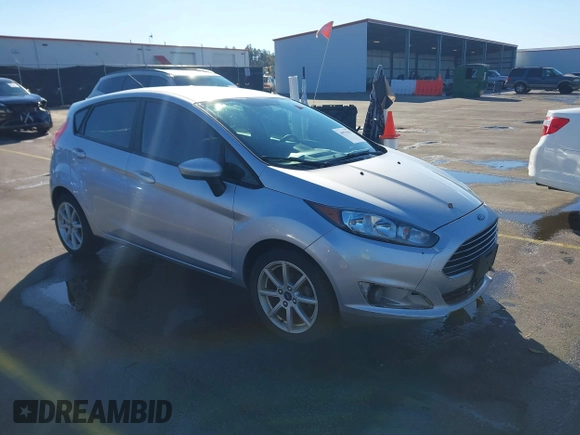 2019 Ford Fiesta SE with VIN 3FADP4EJ0KM107058, listed as a IAAI auction lot 40979683 with 116,854 mi miles. Bid and sale history available at carsss.com. Image 1.